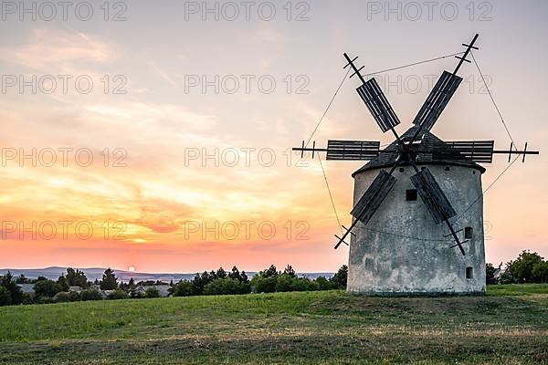 Old historic windmills in the sunset Tesi, balaton