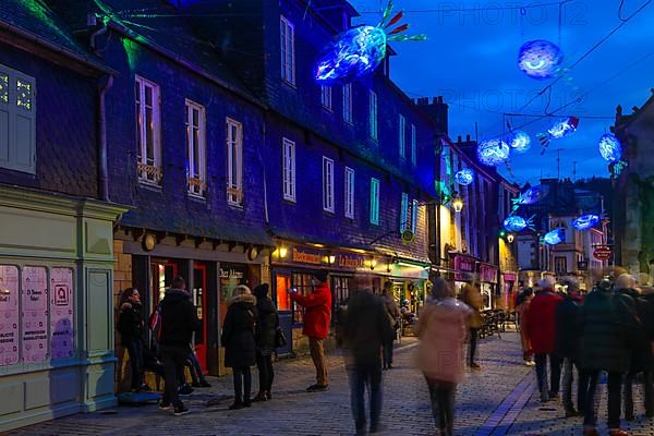 Coloured light installations at Christmas time on the Pont de Rohan bridge over the river Elorn, Landerneau