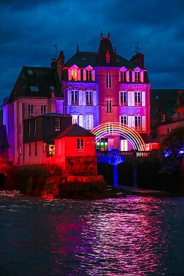 Coloured light installations at Christmas time on the Pont de Rohan bridge over the river Elorn, Landerneau