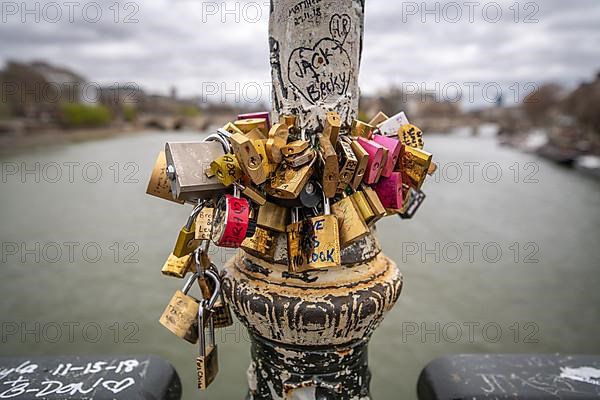 Locks lining the Pont des Arts bridge, also known as the Love Locks Bridge
