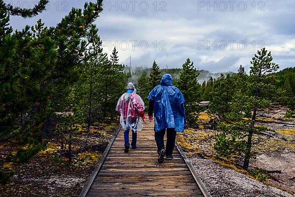 Couple of tourists in Norris Geyser Basin, Yellowstone National Park