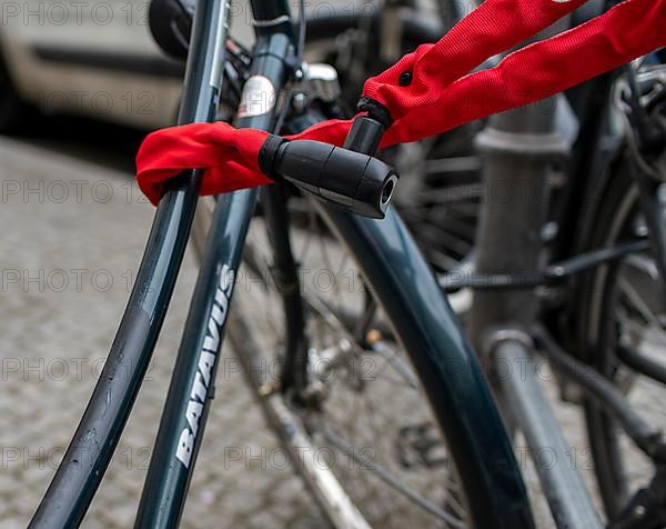 Red safety lock on bicycle, Berlin