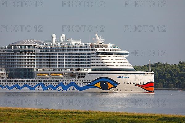 Cruise ship AIDA Perla leaves the port of Hamburg on the Elbe, Wedel