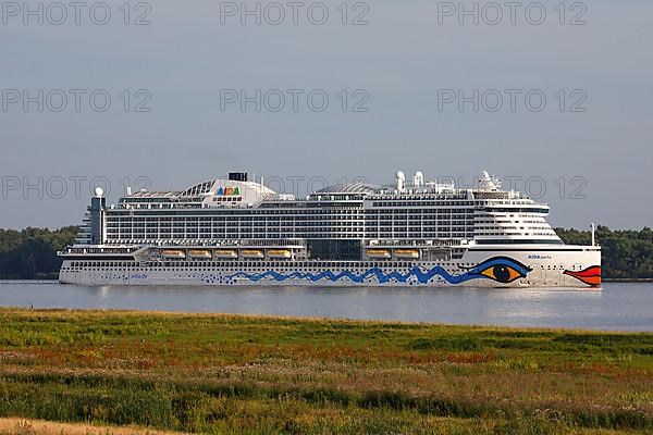 Cruise ship AIDA Perla leaves the port of Hamburg on the Elbe, Wedel