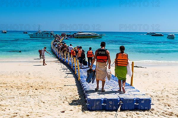 Tourists lining up to board their tourist boats, Koh Rok