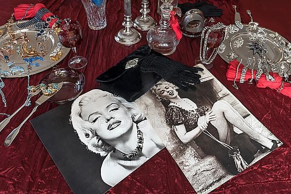 Old Marilyn Monroe photos decorated with accessories and rhinestone jewellery on silver plates, Bavaria