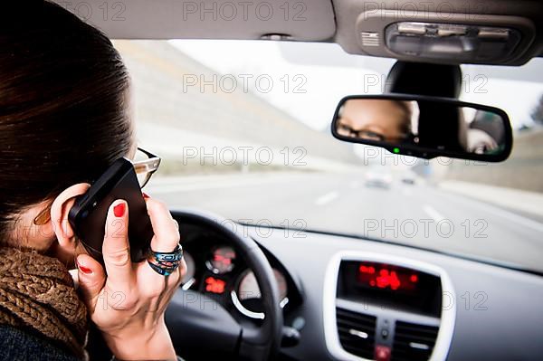 Motorist talks on the phone while driving,