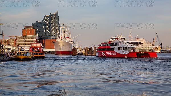 Catamaran from Helgoland on the Elbe in front of the Elbe Philharmonic Hall in Hamburg harbour, Hamburg
