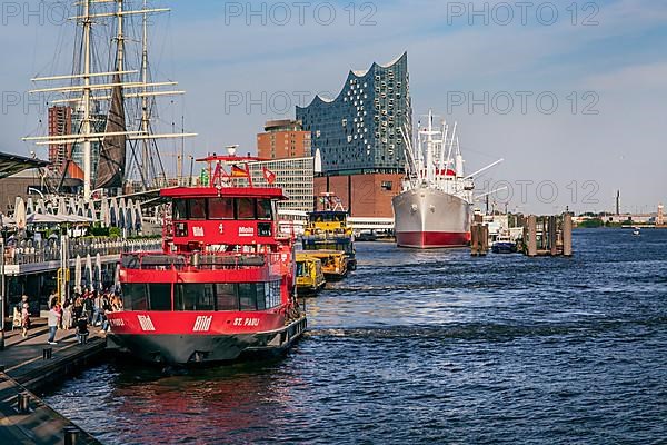 Harbour ferries at the St. Pauli Landungsbruecken with the Elbe Philharmonic Hall on the Elbe in the Port of Hamburg, Hamburg