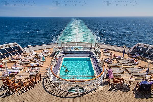 Transatlantic liner, cruise ship Queen Mary 2 with swimming pool on one of the aft decks