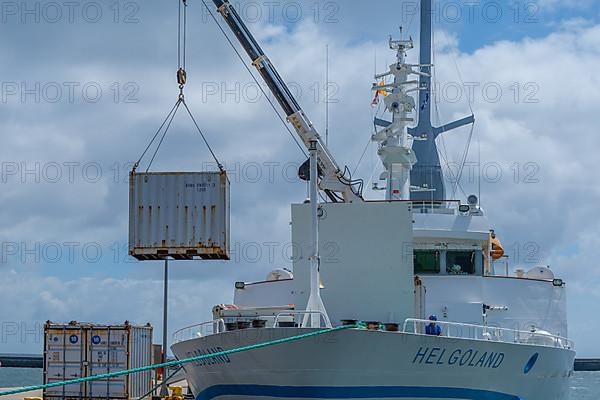 Excursion ship, containers being unloaded by crane