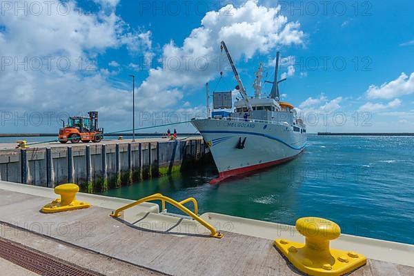 Excursion ship, containers being unloaded by crane