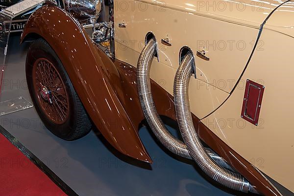 Detail of bonnet with visible exhaust pipes from historic classic sports car Classic Car Roadster Lagonda LG 45 Rapide from 30s 1937 by Clark Gable, constructor W. O. Bentley