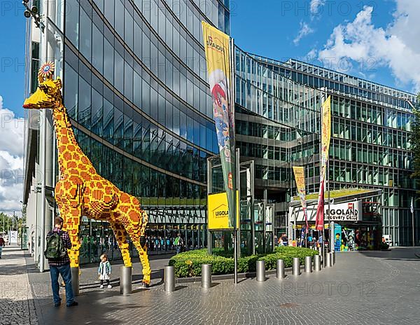 Giraffe made of Lego bricks in front of the entrance to Legoland at the Sony Center, Potsdamer Platz