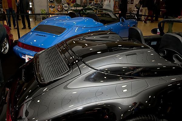 Two historic classic cars Porsche 911 964 Speedster two-seater with body with typical two humps over back seat, Techno Classica fair