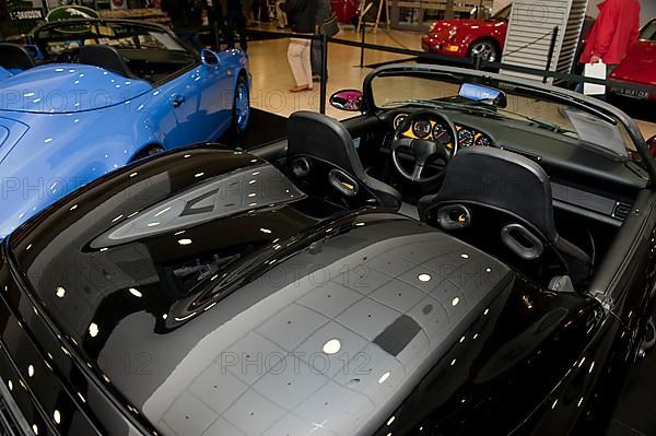 Historic classic car Porsche 911 964 Speedster two-seater with body with typical two humps over back seat, Techno Classica fair