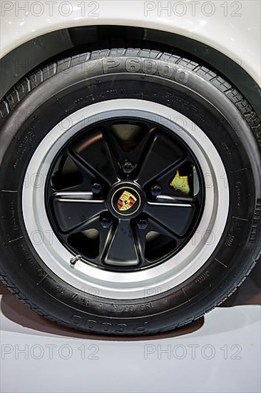 Classic historic black Fuchs rim, Porsche logo emblem in the middle