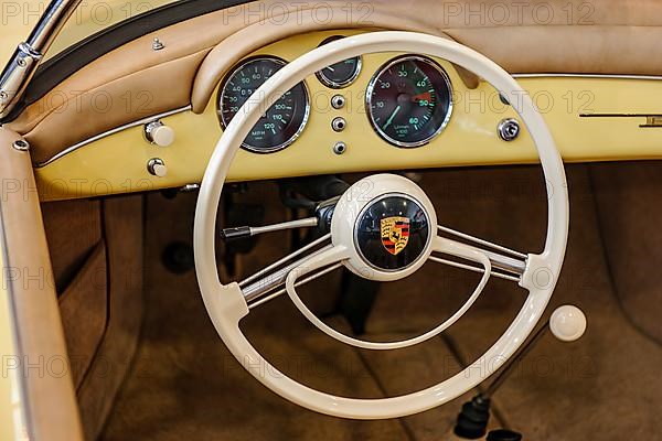 Ivory white steering wheel with two spokes Two-spoke steering wheel from historic classic car Classic Car Porsche 356, behind dashboard