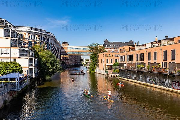 Boats, a SUP and a Venetian gondola at the Buntgarnwerke on the Weisse Elster