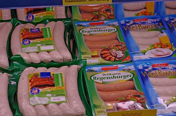 Packaged sausages in the fresh food counter in a supermarket,