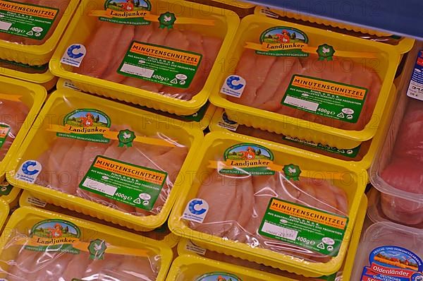 Packed pork cutlets in the refrigerated counter in a supermarket,