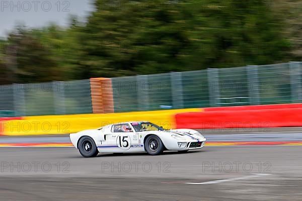 Photo of historic racing car Ford GT40 on Spa Francorchamps race track in curve 1 La Source, Ardennes roller coaster