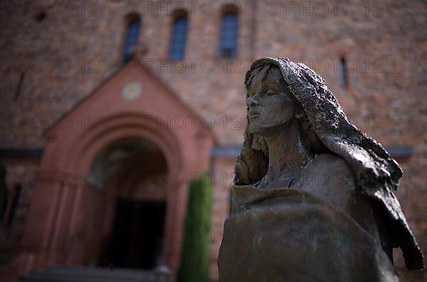 Statue of Saint Hildegard of Bingen in front of the abbey church, St. Hildegard Abbey