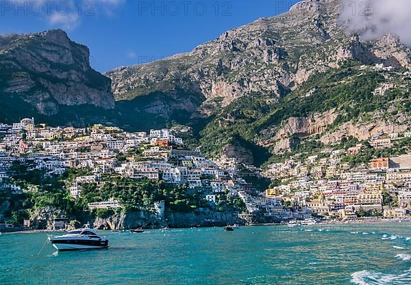 Village view from the sea with the mountain backdrop, Positano