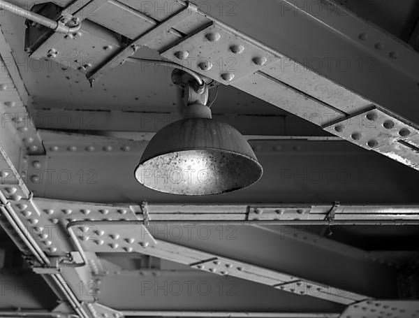 Black and white, old ceiling lighting in a factory