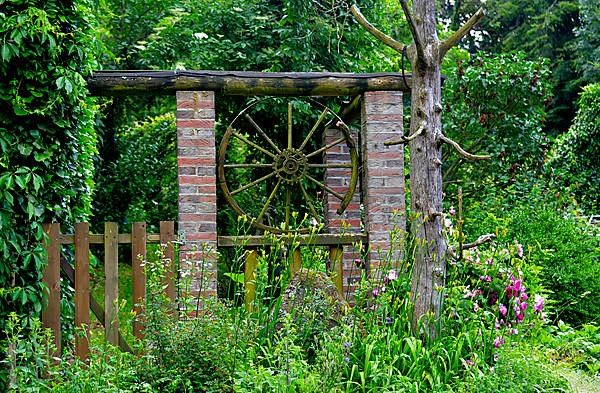 Nature garden old wagon wheel