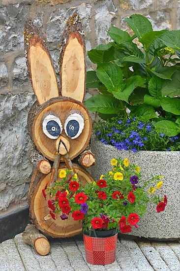 Petunias in Pot Flowering with Wooden Bunny