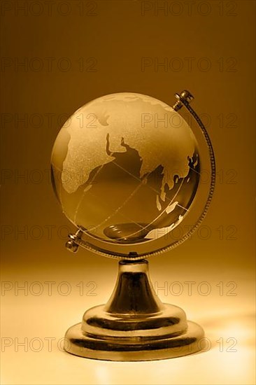 Crystal glass globe orange tinted