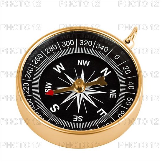 Old brass compass isolated on white background