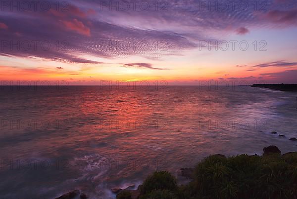 Ocean sunset on rocky coast. Varkala