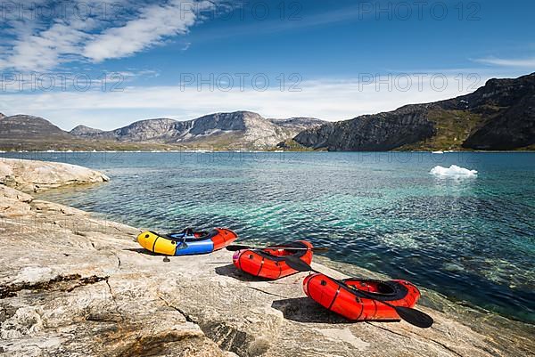 3 Packrafts on rocks