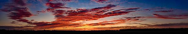 Sunset with red coloured clouds on the evening of the solstice