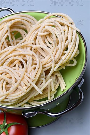 Pici pasta in kitchen colander