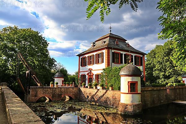 Moated castle Klein-Welzheim in Seligenstadt with a Dutchman's bridge. Seligenstadt