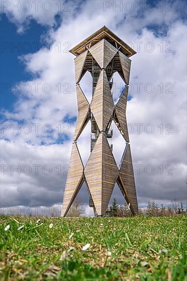 Lookout tower Altbergturm on green meadow in spring