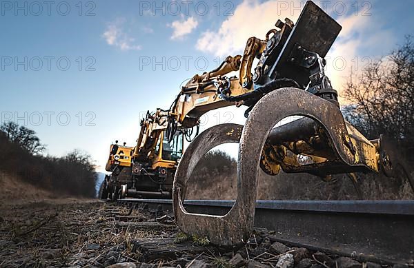 Rail excavator with grab arm in Althengstett