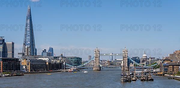 Tower Bridge The Shard ships and other skyscrapers on the Thames London England