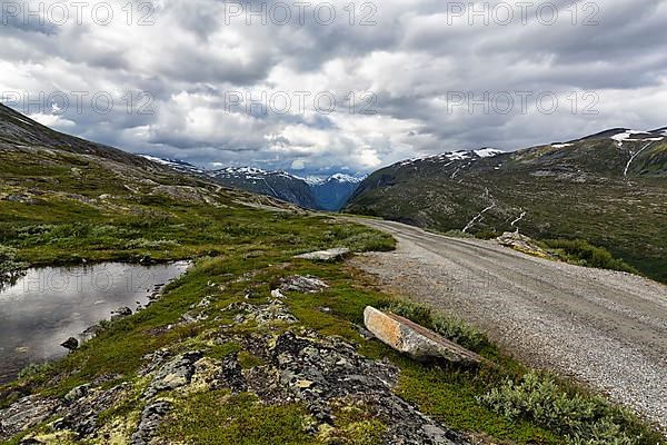 Gravel road through barren mountain landscape