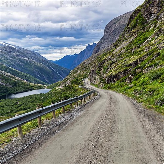 Gravel road through typical mountain landscape