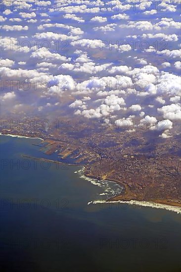 Aerial view of Casablanca under cloudy skies from high altitude. Casablanca-Settat