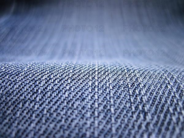 Denim jeans as blue background. Depicted with depth of field to fill the image