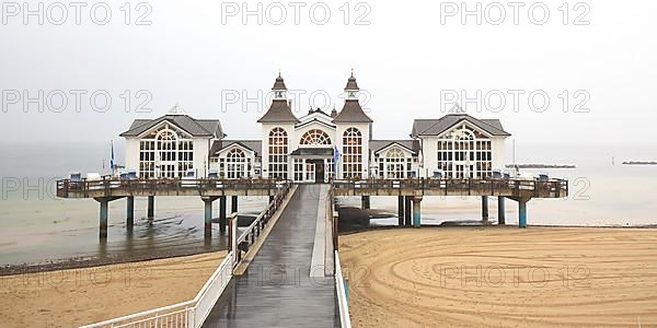 Sellin pier on the Baltic Sea island of Ruegen at fog