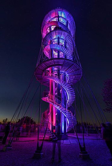 Colourfully illuminated Schoebuchturm observation tower at night