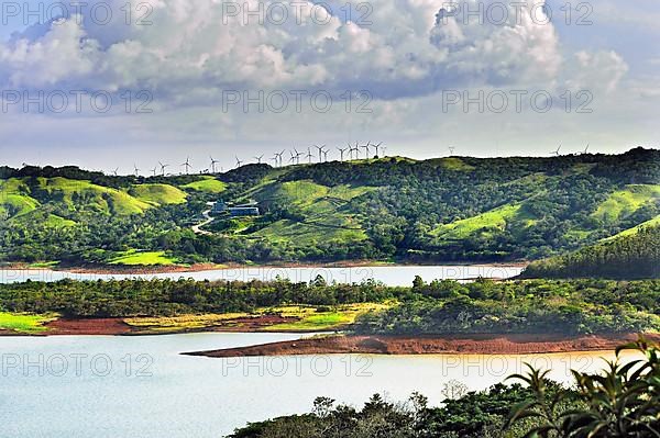 West shore of Lake Arenal with new hotel and wind turbines