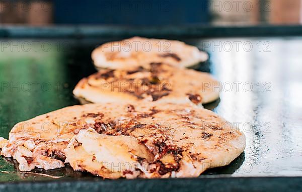 Traditional Nicaraguan pupusas with melted grilled cheese