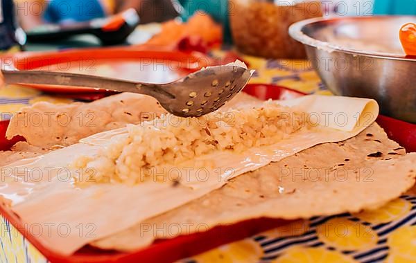 Preparation of the Traditional Nicaraguan Quesillo. Hands making delicious Nicaraguan Quesillo. Central American food the Quesillo